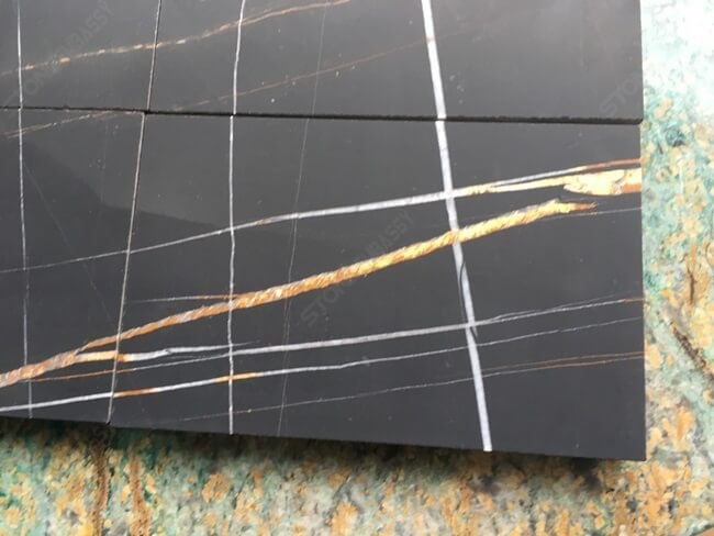honed sahara noir marble tiles