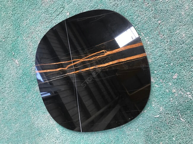 polished sahara noir marble table top